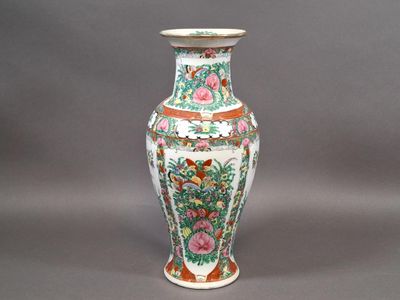 a vase that is sitting on a gray surface