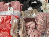 many different types of clothing on display in a store