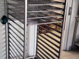 an image of a metal rack with a tray of food on it