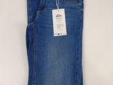 the back of a pair of blue jeans with a tag on it