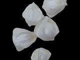 four pieces of white paper are arranged on a black surface