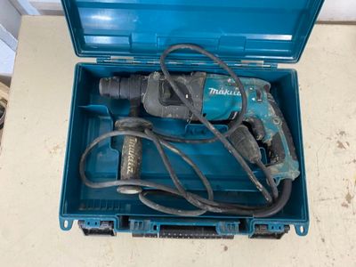 a blue tool box with a hammer and other tools in it