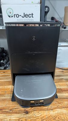 an image of a coffee machine sitting on a wooden table