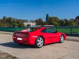 a red sports car parked on the side of the road