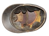 a close up of a helmet with a hole in it
