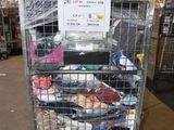 a metal cart with a lot of shoes in it