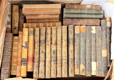 many old books in a box on the floor