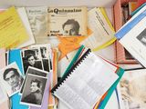 a box full of books and papers on a table
