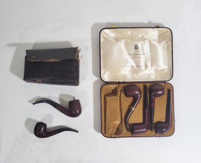 a box with a pipe, a wallet, and a pair of glasses