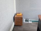 an image of a room with a desk and a chair in it