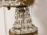 two chandeliers hanging from the ceiling of a room