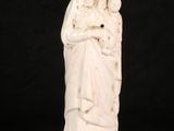 an image of a statue of a woman holding a child