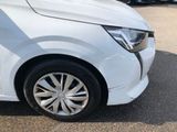 a white car parked in a parking lot with other cars in the background