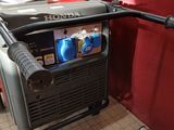a portable generator that is sitting in the corner of a room