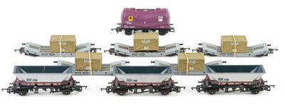 a lot of small toy trains that are on the tracks