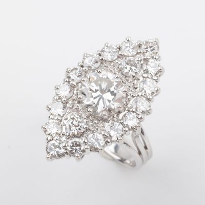 a close up of a diamond ring on a white background