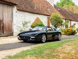 a black sports car parked on the side of the road