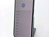 a phone that is sitting on a stand on a table