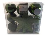 four christmas ornaments in a clear box on a white background