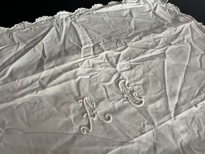an image of a piece of cloth with a monogram on it