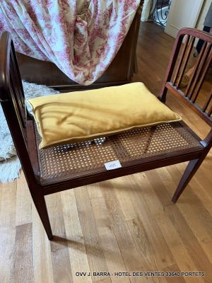 a chair that has a pillow on top of it