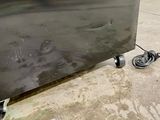 a metal box that is sitting on the ground