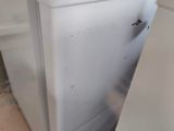 a person that is pulling a refrigerator out of the floor