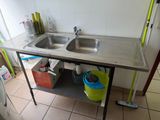 a sink and a counter in a small room