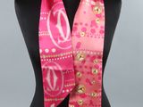 a close up of a pink scarf on a mannequin mannequin