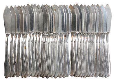 a lot of forks and spoons stacked on top of each other