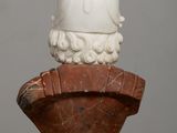 a marble bust of a man with a helmet on top of it