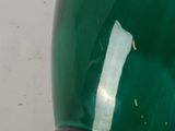 an image of a green lamp sitting on top of a white table