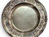 an antique silver plate on a white background with a white background
