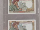 deux billets de banque différents représentant un homme portant un turban et une femme portant un turban