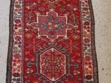 an oriental rug on the floor in a room with a white floor