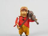 une petite figurine représentant un homme jouant du violon