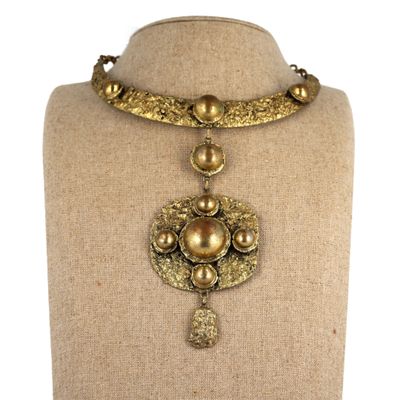 a close up of a necklace on a mannequin mannequin