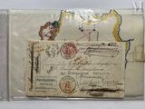 an old envelope with a map of the world on it