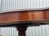 a close up of a wooden table with a bird on it