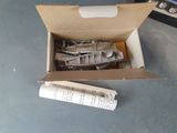 a box with a bunch of metal parts inside of it
