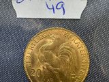 a close up of a gold coin with a label on it
