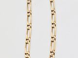 a gold chain necklace with a link on a white background