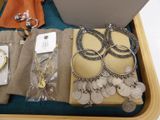 a suitcase with a bunch of jewelry inside of it
