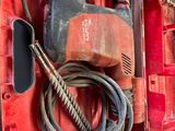 an image of a red tool box with tools in it