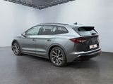 the rear end of a silver car in a white room