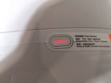a close up of a machine with a red light on it
