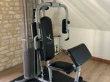a gym equipment set up in the corner of a room