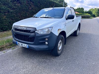 a picture of a white pick up truck parked on the side of the road