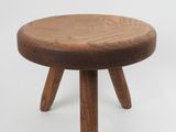 an image of a small wooden stool on a white background