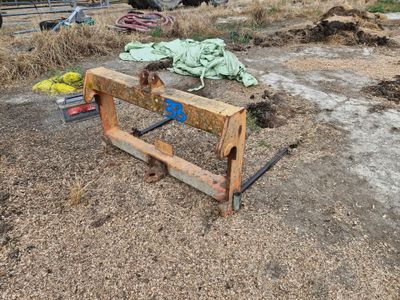 a wooden bench that is sitting in the dirt